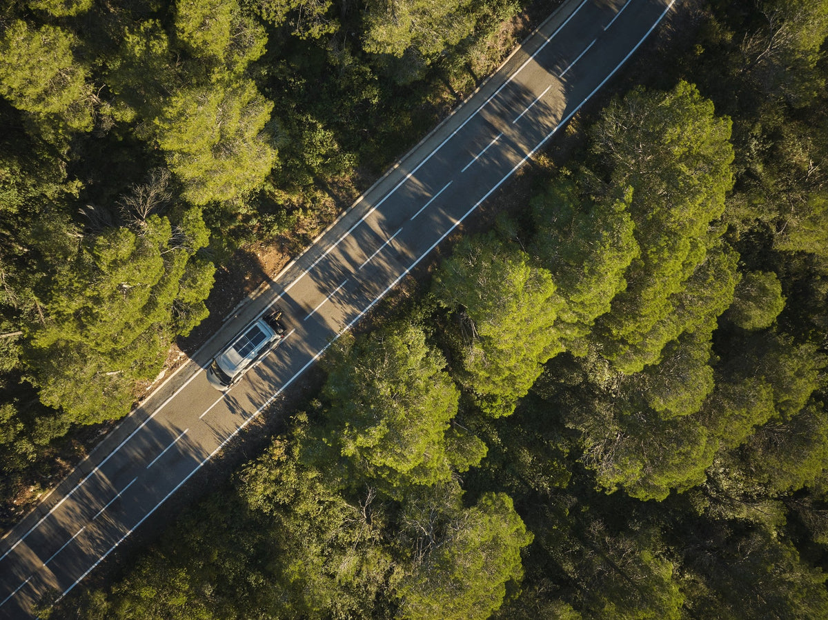 car on road with solar panels